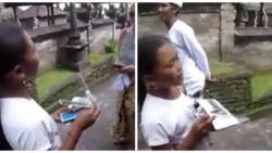 Gorgeous girl selling postcards in the street speaks 22 different languages