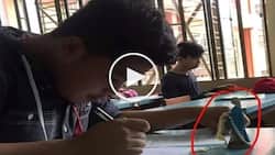 Netizens discuss the photo of Pinoy student who brought Virgin Mary statue to exams