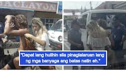 Filipinos react to viral photos of Bohol police who reprimanded foreign tourists for wearing swimsuits in the streets