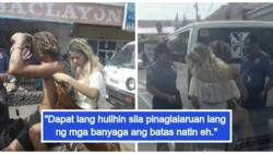 Filipinos react to viral photos of Bohol police who reprimanded foreign tourists for wearing swimsuits in the streets