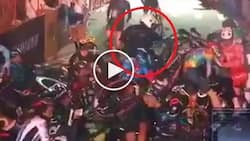 Motorcycle rider causes massive pile-up during intense bicycle race