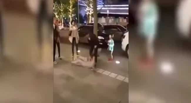 A cruel husband was beating his wife on street