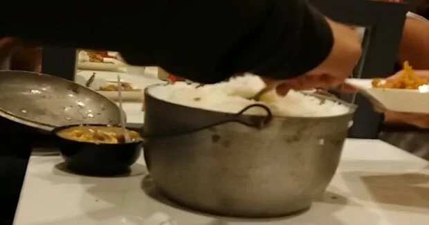 Boy enjoys extra rice at KFC by bringing own rice pot