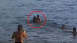 Couple are stuck together while making love in the sea
