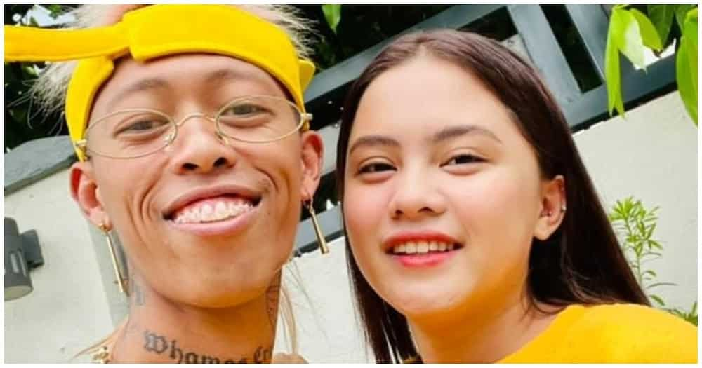 Antonette Gail cheers on Whamos Cruz during his basketball game