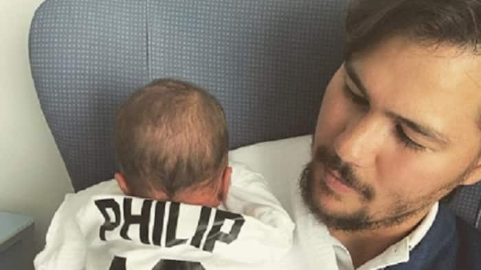 Phil Younghusband & wife introduce their newborn baby to the world