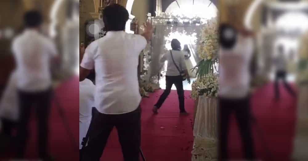 Video ng official photographer na naloka dahil sa umeksenang guest sa bridal walk ng ikakasal, viral