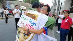Break the stigma! HIV positive person gets a warm hug from a priest